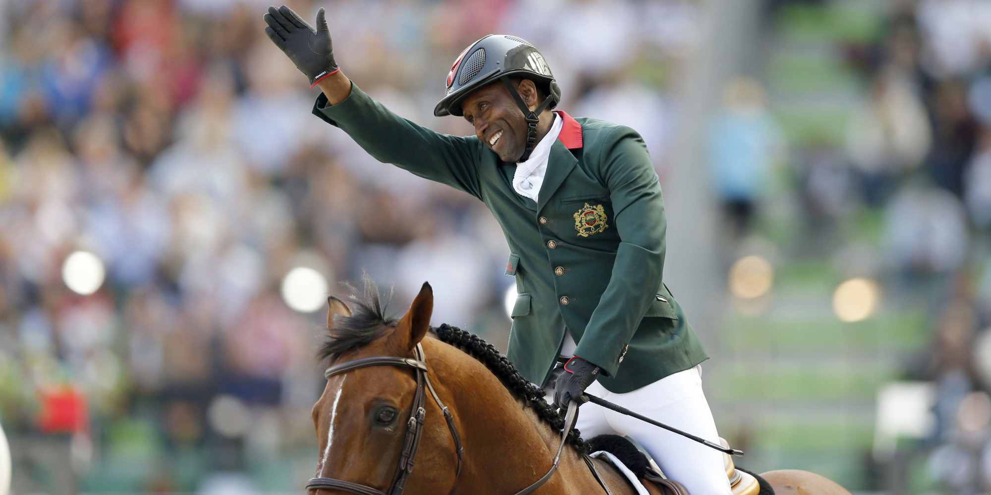 Abdelkebir Ouaddar of Morocco riding Quickly De Kreisker celebrates during the individual second round event of the Jumping Competition at the World Equestrian Games in Caen, September 4, 2014. REUTERS/Regis Duvignau (FRANCE - Tags: SPORT EQUESTRIANISM ANIMALS)