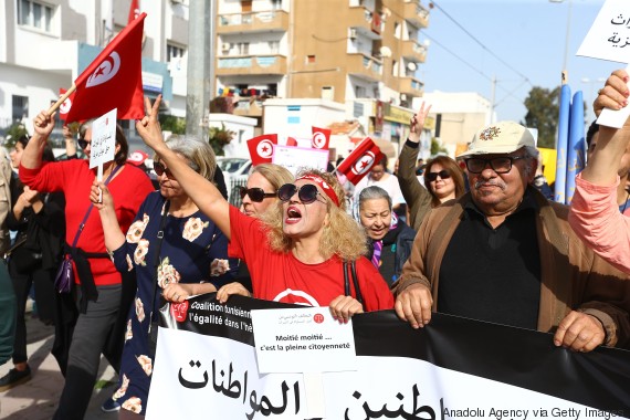 TUNIS, TUNISIA - MARCH 10: Hundreds of demonstrators hold placards and shout slogans during a march from Bab Sadun to Bardo square, demanding equal inheritance rights for women in Tunis, Tunisia on March 10, 2018. (Photo by Yassine Gaidi/Anadolu Agency/Getty Images)