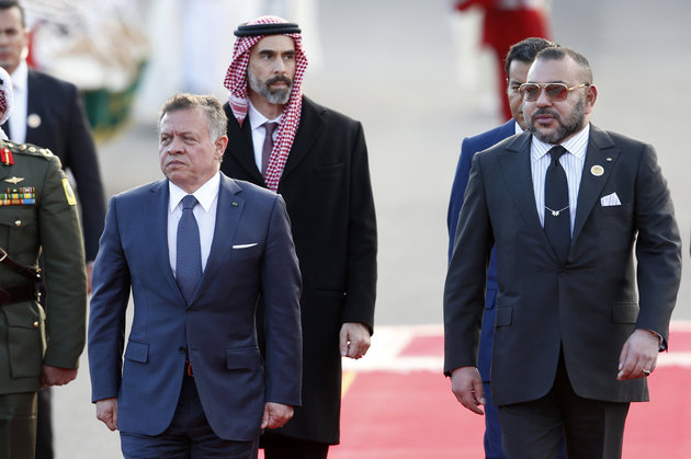 Moroccan King Mohammed VI, right, and Jordan's King Abdullah II review royal guard at the king's palace in Rabat, Morocco, Wednesday March 22, 2017. Jordan's King Abdullah II is on a two-day visit to Morocco on the invitation of King Mohammed VI. (AP Photo/ Abdeljalil Bounhar)