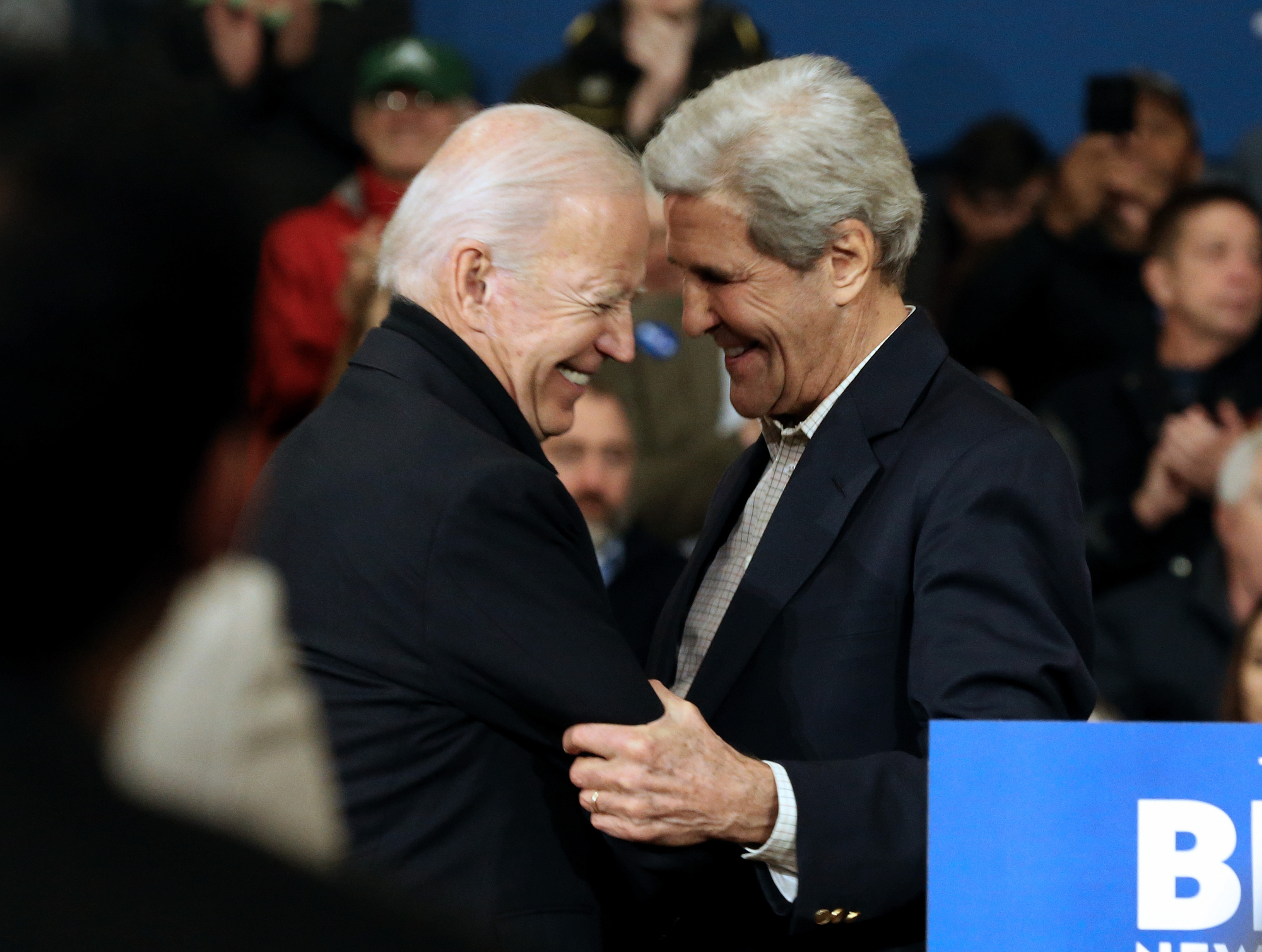NASHUA, NH - DECEMBER 8: Former Vice President Joe Biden, who is running for president, embraces former Secretary of State John Kerry during a campaign event at Nashua Community College on December 8, 2019 in Nashua, Massachusetts. (Staff Photo By Angela Rowlings/MediaNews Group/Boston Herald)